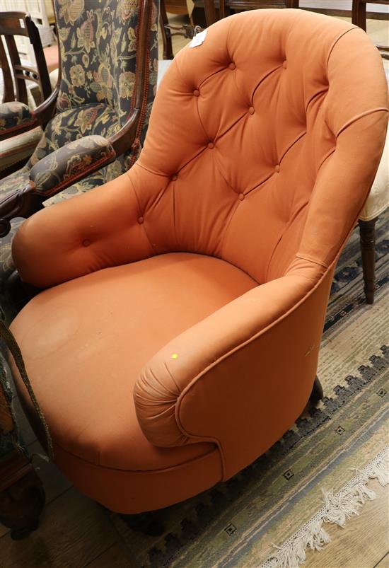 A Victorian button back armchair